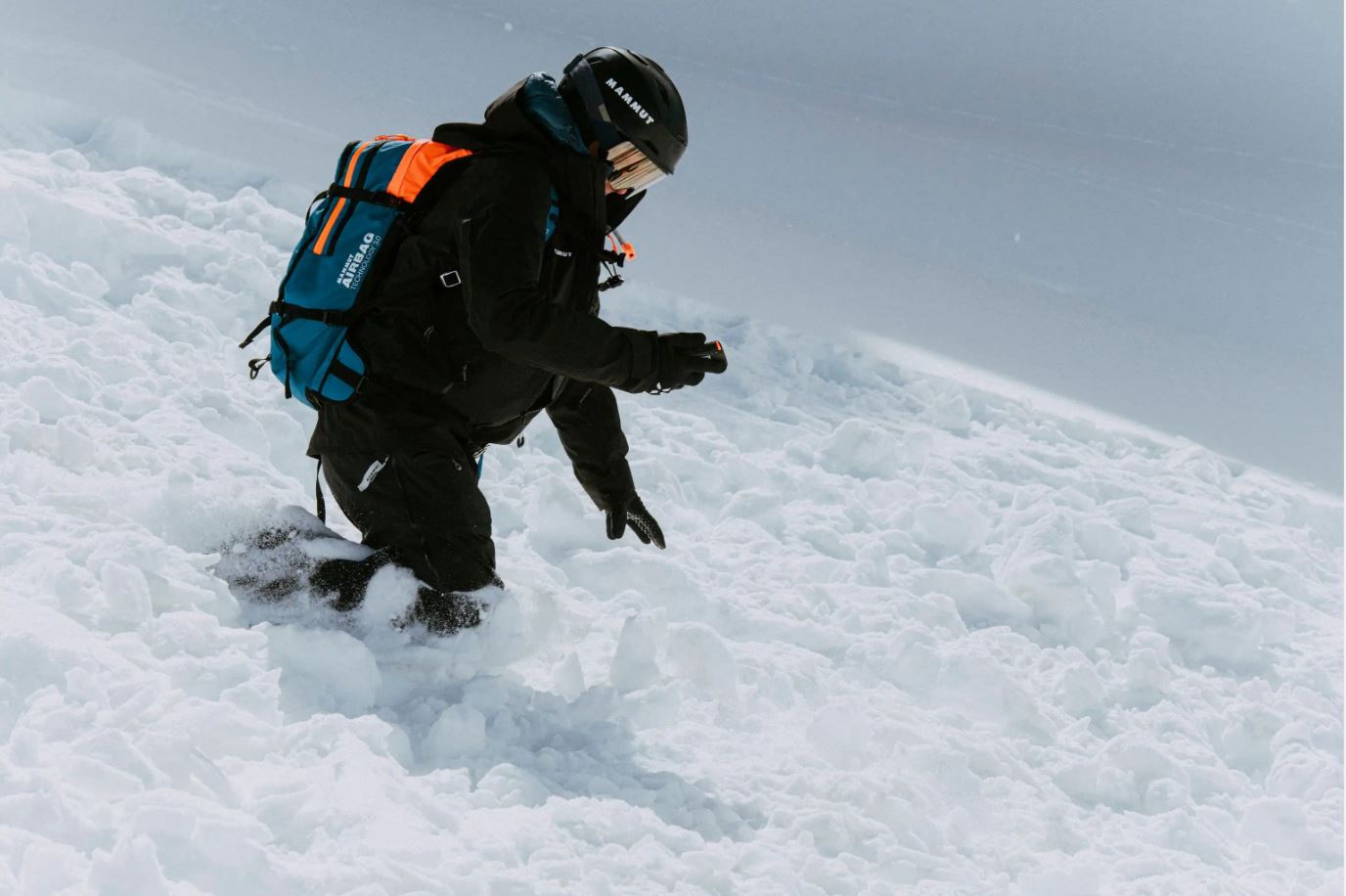 Man using avalanche beacon 